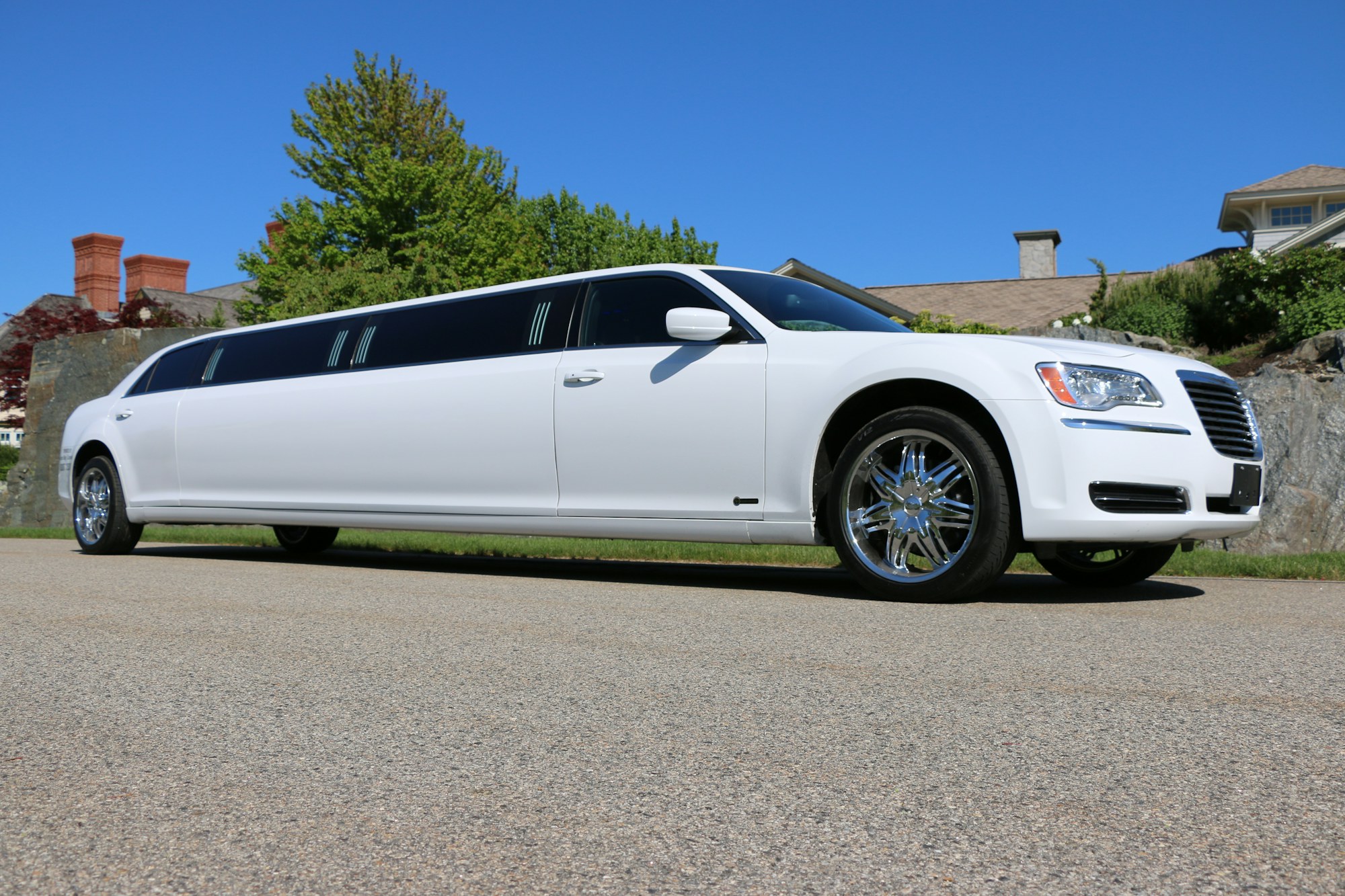 Full side view of a white classic stretch limousine